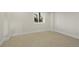 Cozy bedroom with natural light, neutral walls, and plush carpeting at 1888 Oakcrest Cir, Castle Rock, CO 80104