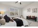 Well-lit bedroom with vaulted ceilings, plush carpet and a comfortable bench at 1888 Oakcrest Cir, Castle Rock, CO 80104