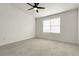 Spacious bedroom offers lots of natural light with neutral-colored carpet at 1888 Oakcrest Cir, Castle Rock, CO 80104