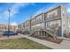 Townhome featuring neutral siding, sidewalks, stairs, and lawns at 1888 Oakcrest Cir, Castle Rock, CO 80104