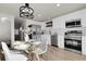 Well-designed kitchen with stainless steel appliances, stylish cabinetry, and a cozy dining space at 1888 Oakcrest Cir, Castle Rock, CO 80104