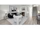 Bright living room boasts a cozy fireplace, modern decor, and plenty of natural light at 1888 Oakcrest Cir, Castle Rock, CO 80104