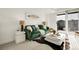 Cozy living room featuring an emerald sofa, modern decor, and sliding glass door at 1888 Oakcrest Cir, Castle Rock, CO 80104