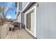 Relaxing outdoor patio featuring a grill, with sliding door access and privacy fence at 1888 Oakcrest Cir, Castle Rock, CO 80104