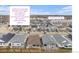 An aerial view of a neighborhood showcases the proximity to the nearby light rail station and Central Denver at 5331 Routt Ct, Arvada, CO 80002
