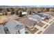 An aerial view of the home showcases the surrounding neighborhood and large treed lots at 5331 Routt Ct, Arvada, CO 80002