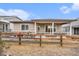 Backyard with a covered patio, grill, and wood fence at 5331 Routt Ct, Arvada, CO 80002