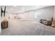 The expansive finished basement features plush carpet and a large, open area perfect for recreation and relaxation at 5331 Routt Ct, Arvada, CO 80002