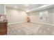Bright basement area with plush carpet, a window for natural light, and cozy decor, perfect for relaxation at 5331 Routt Ct, Arvada, CO 80002