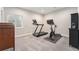 Cozy exercise room with gray carpet, exercise bike, and treadmill for home workouts at 5331 Routt Ct, Arvada, CO 80002