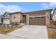 Beautiful single-Gathering home with stone accents, two-car garage, and a well-maintained lawn at 5331 Routt Ct, Arvada, CO 80002