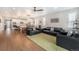 Open-concept living area with a combined kitchen, dining, and living room at 5331 Routt Ct, Arvada, CO 80002