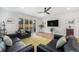 Bright living room features hardwood floors and large sliding glass doors to an outdoor deck at 5331 Routt Ct, Arvada, CO 80002