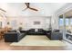 Inviting living room with a large yellow rug, hardwood floors, and comfortable seating arrangement at 5331 Routt Ct, Arvada, CO 80002