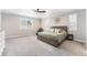 Well-lit main bedroom with a large window, a chair, and a serene ambiance at 5331 Routt Ct, Arvada, CO 80002