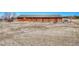 Exterior shot of a red barn with a metal roof and fenced area at 12925 Sierra Cir, Parker, CO 80138