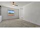 Bedroom featuring neutral carpet, bright window, and view of outside at 12925 Sierra Cir, Parker, CO 80138