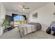 A comfortable bedroom with a ceiling fan and a large window with a view at 12925 Sierra Cir, Parker, CO 80138