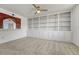 Bedroom featuring built-in shelving units with brick archway and natural light at 12925 Sierra Cir, Parker, CO 80138