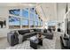 Stylish living room featuring a comfortable sectional sofa, modern decor, and panoramic views through large windows at 12925 Sierra Cir, Parker, CO 80138
