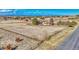 Expansive property featuring a home, barn, paddock, and perimeter ranch fencing with views of mountains and cityscape at 12925 Sierra Cir, Parker, CO 80138