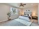 Comfortable bedroom with a large window providing natural light at 15 S Gray St, Lakewood, CO 80226