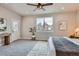 Bright bedroom with a large window and carpet flooring at 15 S Gray St, Lakewood, CO 80226