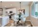 Dining area with modern table and stylish lighting fixtures at 15 S Gray St, Lakewood, CO 80226