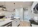 Bright kitchen showcasing a quartz countertop island and stainless steel appliances at 15 S Gray St, Lakewood, CO 80226