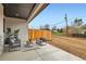 Cozy outdoor patio with comfortable seating and a view of the backyard at 15 S Gray St, Lakewood, CO 80226