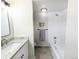 Bathroom with granite countertop vanity and shower/tub combo with white tile at 12970 E 47Th Avenue Cir, Denver, CO 80239