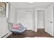 Bedroom featuring closet and chair and doorway access to other parts of the home at 31219 Florence Rd, Conifer, CO 80433