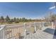 Enjoy beautiful views from this balcony featuring white railings and stylish outdoor decor at 4090 S Tamarac Dr, Denver, CO 80237