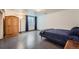 Bedroom with a closet, window, and gray carpet at 4090 S Tamarac Dr, Denver, CO 80237