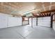 Spacious garage with painted walls, and garage door with opener at 4090 S Tamarac Dr, Denver, CO 80237