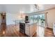 Open kitchen with a center island, stainless steel range, and sliding doors to the outdoor area at 4090 S Tamarac Dr, Denver, CO 80237
