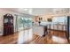 Modern kitchen with a central island, stainless steel appliances, and access to the back deck at 4090 S Tamarac Dr, Denver, CO 80237