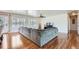 Bright living room with hardwood floors, lots of natural light, and large sectional sofa at 4090 S Tamarac Dr, Denver, CO 80237