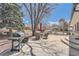 An outdoor patio complete with a BBQ area and seating at 4090 S Tamarac Dr, Denver, CO 80237