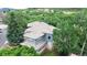 Stunning aerial view of home showing its location and lush surroundings; a verdant, private paradise at 6503 Big Horn Trl, Littleton, CO 80125