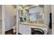 Bathroom featuring a vanity, toilet, and mirror with medicine cabinet at 6503 Big Horn Trl, Littleton, CO 80125