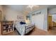 Inviting bedroom with a beach theme, featuring a view of a large closet, with a nautical theme at 6503 Big Horn Trl, Littleton, CO 80125