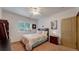 Comfortable bedroom featuring bright natural light and traditional decor at 6503 Big Horn Trl, Littleton, CO 80125