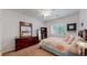 Cozy bedroom with stylish decor, ample natural light, and warm, inviting atmosphere at 6503 Big Horn Trl, Littleton, CO 80125