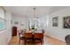Formal dining room features hardwood floors, a stylish chandelier, and adjacent to kitchen at 6503 Big Horn Trl, Littleton, CO 80125