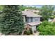 Picturesque home showcasing its architectural details, landscaped yard, and peaceful outdoor living space at 6503 Big Horn Trl, Littleton, CO 80125