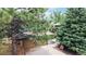 Charming home exterior with mature trees, inviting curb appeal, and a well-maintained two-car garage at 6503 Big Horn Trl, Littleton, CO 80125