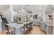 Modern kitchen with a large island, pendant lights, stainless steel appliances and bright lighting at 6503 Big Horn Trl, Littleton, CO 80125