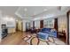 Bright living room featuring a comfortable seating area and wood look floors, recessed lighting, and a wet bar at 6503 Big Horn Trl, Littleton, CO 80125