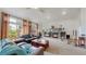 Spacious living room boasts large windows, fireplace, vaulted ceilings and flows with natural light at 6503 Big Horn Trl, Littleton, CO 80125